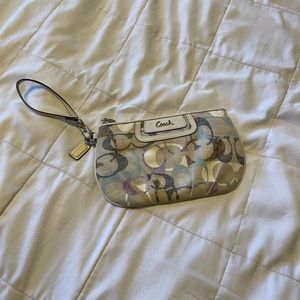 Coach , wristlet , handpurse , cream blue purple . Beautiful pastel colors